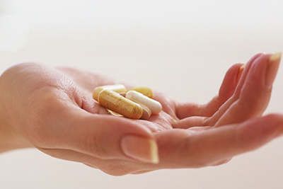 Таблетки в руке Таблетки в руке